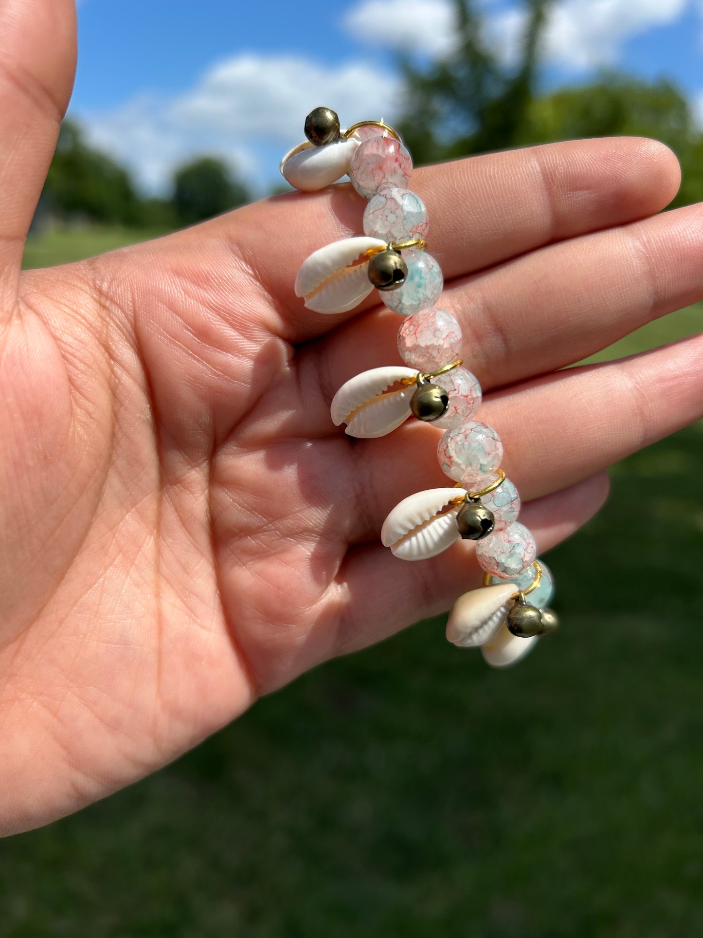 Copped Bells And Cowrie Shells Glass Bracelet